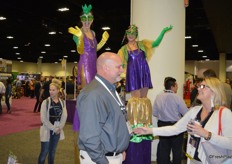 Walking on stilts and still smiling and waving.